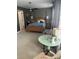 Main bedroom features a ceiling fan, a cozy sitting area and neutral carpeting at 8350 Brickle Ln, Huntersville, NC 28078