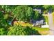 An aerial view of a home with mature trees, a fenced backyard, and a well-maintained lawn at 840 10Th Street Nw Blvd, Hickory, NC 28601