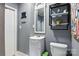 Neutral colored bathroom featuring a vanity, toilet, mirror, and shelves at 840 10Th Street Nw Blvd, Hickory, NC 28601