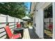 Back deck with a fire pit, grill, outdoor dining set, and a charming white picket fence for cozy outdoor gatherings at 840 10Th Street Nw Blvd, Hickory, NC 28601