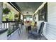 This charming front porch features ample seating, hanging plants, and a swing, perfect for relaxing outdoors at 840 10Th Street Nw Blvd, Hickory, NC 28601