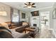 Comfortable living room with fireplace, wood flooring, and open layout to the kitchen at 840 10Th Street Nw Blvd, Hickory, NC 28601