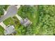 Aerial view of a home with well-manicured landscaping and mature trees at 9040 Scottsboro Dr, Huntersville, NC 28078