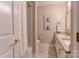 Bright bathroom with a double sink vanity and a shower with a curtain at 9040 Scottsboro Dr, Huntersville, NC 28078