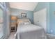 Comfortable bedroom with soft blue walls, carpet, and large double door closet at 9040 Scottsboro Dr, Huntersville, NC 28078
