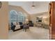 Comfortable living room with vaulted ceilings and large windows for natural light at 9040 Scottsboro Dr, Huntersville, NC 28078