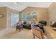 Bright, carpeted living room with vaulted ceilings and plenty of natural light at 9040 Scottsboro Dr, Huntersville, NC 28078