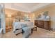 This main bedroom suite includes a large bed, soft lighting, and natural light at 9040 Scottsboro Dr, Huntersville, NC 28078