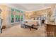 Spacious main bedroom with a tray ceiling, many windows, and neutral decor at 9040 Scottsboro Dr, Huntersville, NC 28078