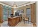 Office area with a wooden desk, hardwood flooring, natural light, and neutral paint at 9040 Scottsboro Dr, Huntersville, NC 28078