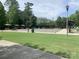 Outdoor amphitheater with paved seating, benches, and manicured lawn for community events and performances at 919 Lily Magnolia Ct, Fort Mill, SC 29707