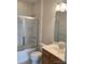 Cozy bathroom features a shower over tub, vanity, and tile flooring at 919 Lily Magnolia Ct, Fort Mill, SC 29707
