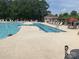 Inviting community pool with lounge chairs, umbrellas, and a separate wading area for relaxation and recreation at 919 Lily Magnolia Ct, Fort Mill, SC 29707