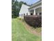 Exterior shot with well manicured lawn, mulch beds, and trimmed bushes at 919 Lily Magnolia Ct, Fort Mill, SC 29707