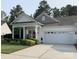 Lovely single-story home with a well-maintained lawn and an attached two-car garage at 919 Lily Magnolia Ct, Fort Mill, SC 29707