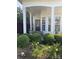 Inviting covered front porch with comfortable seating and beautiful landscaping at 919 Lily Magnolia Ct, Fort Mill, SC 29707