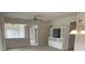 Bright living room features neutral walls, ceiling fan, and built-in entertainment center at 919 Lily Magnolia Ct, Fort Mill, SC 29707