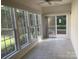Bright sunroom with sliding glass doors and many windows overlooking an outdoor patio at 919 Lily Magnolia Ct, Fort Mill, SC 29707