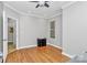 Bedroom with hardwood floors, a ceiling fan, closet, and natural light from window at 921 Northeast Dr, Davidson, NC 28036