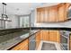 Kitchen with stainless steel appliances, a granite countertop, and maple cabinets at 921 Northeast Dr, Davidson, NC 28036