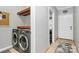 Modern laundry room with a front-load washer and dryer and convenient shelving at 921 Northeast Dr, Davidson, NC 28036
