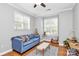Comfortable living room with bright windows, hardwood floors, and stylish modern decor at 921 Northeast Dr, Davidson, NC 28036