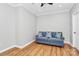Bright living room with hardwood floors and a comfortable blue couch with stylish pillows at 921 Northeast Dr, Davidson, NC 28036
