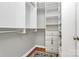 Organized walk-in closet with custom shelving, drawers and hanging rods for optimal storage at 921 Northeast Dr, Davidson, NC 28036