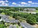 Inviting aerial perspective captures the neighborhood with verdant greenery and meticulously kept townhomes at 10078 Pergola View Ct, Charlotte, NC 28213