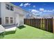 Backyard with artificial grass and fenced perimeter at 10078 Pergola View Ct, Charlotte, NC 28213