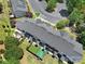 Aerial view of townhome backyards with patios, landscaping, and artificial turf areas at 10078 Pergola View Ct, Charlotte, NC 28213