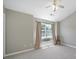 Neutral bedroom featuring plush carpeting, a window with natural light, and a ceiling fan at 10078 Pergola View Ct, Charlotte, NC 28213