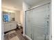 Bathroom featuring a granite countertop, white cabinets, and a glass shower enclosure at 103 Springway Dr, Kannapolis, NC 28081