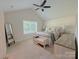 Bedroom with vaulted ceilings, a large window, and neutral decor creating a peaceful space at 103 Springway Dr, Kannapolis, NC 28081