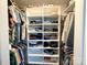 Well-organized walk-in closet featuring built-in shelving for shoes and folded clothing at 103 Springway Dr, Kannapolis, NC 28081