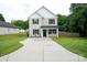 Charming two-story home featuring a spacious concrete driveway and manicured lawn at 103 Springway Dr, Kannapolis, NC 28081