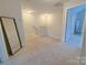 Bright hallway with neutral carpet, natural light, and access to other rooms in the home at 103 Springway Dr, Kannapolis, NC 28081