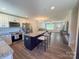 Open-concept kitchen with stainless steel appliances, granite countertops and an island with seating at 103 Springway Dr, Kannapolis, NC 28081