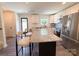 Bright kitchen featuring granite countertops, stainless steel appliances and a view to backyard at 103 Springway Dr, Kannapolis, NC 28081