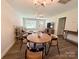Cozy living room with modern light fixtures, a dining area and access to the kitchen at 103 Springway Dr, Kannapolis, NC 28081