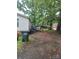 Backyard featuring a wooden deck and residential garbage service at 111 Crystal Creek Dr, China Grove, NC 28023