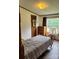 Comfortable bedroom with natural light, ceiling fan and hardwood floors, and a spacious closet at 111 Crystal Creek Dr, China Grove, NC 28023