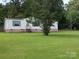 Exterior of home featuring brick base and green shutters at 111 Crystal Creek Dr, China Grove, NC 28023