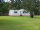 Exterior of home featuring brick base and green shutters at 111 Crystal Creek Dr, China Grove, NC 28023