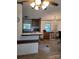 Kitchen featuring a breakfast bar open to the living area with wood-look flooring at 111 Crystal Creek Dr, China Grove, NC 28023