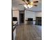 Spacious living room with a stone fireplace, wood-look flooring and a ceiling fan at 111 Crystal Creek Dr, China Grove, NC 28023
