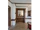 Living room with wood trim and floors featuring a built-in shelving unit at 111 Crystal Creek Dr, China Grove, NC 28023
