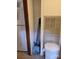 Small utility closet with cleaning supplies, water bottles, and white trash can at 111 Crystal Creek Dr, China Grove, NC 28023