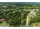 Aerial view of the property nestled among lush trees in a quiet neighborhood at 1115 Sides Rd, Salisbury, NC 28146