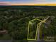 Aerial view of the property with boundary outline, showing location in a wooded neighborhood at 1115 Sides Rd, Salisbury, NC 28146